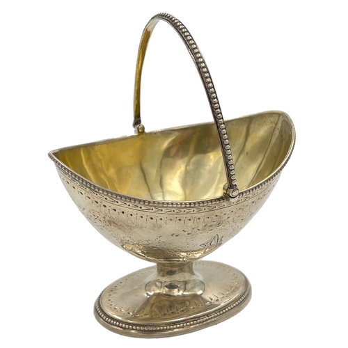 151 - A GEORGIAN SILVER SWING HANDLE SUGAR BASKET RAISED ON A PEDESTAL FOOT, ROBERT HENNELL I, 1787A Georg... 