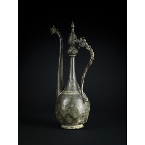 109 - A SAFAVID BRONZE EWER, PERSIA, 17TH CENTURY This elegantly crafted bronze ewer from the Safavid peri... 