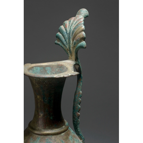 110 - AN UMAYYAD OR EARLY ABBASID BRONZE EWER, PERSIA OR MESOPOTAMIA, 8TH/ 9TH CENTURY    of piriform on a... 