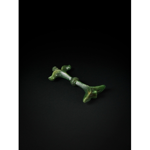 126 - MUGHAL SPINACH JADE HILT, INDIA, 19TH CENTURY Spinach jade Mughal Jade hilt intricately carved with ... 