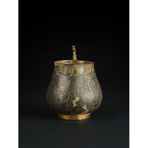 127 - A SILVER-GILT AND NIELLO HANDLED CUP, PERSIA, 11TH/12TH CENTURY    This cup features silver gilding ... 