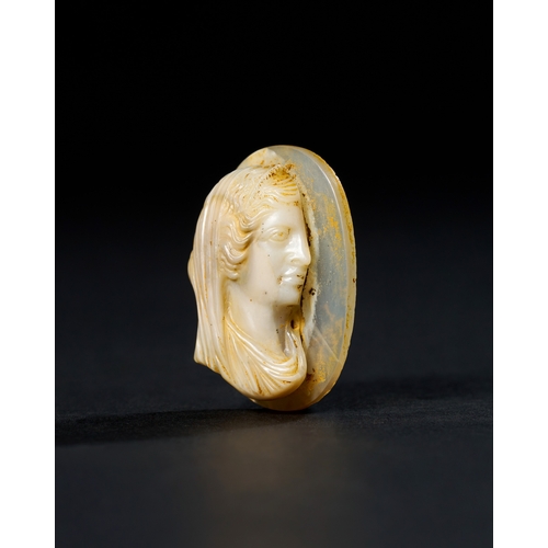 13 - A ROMAN SARDONYX AGATE CAMEO DEPICTING A DEITY, 2ND CENTURY A.D. OR LATER This exquisite Roman cameo... 