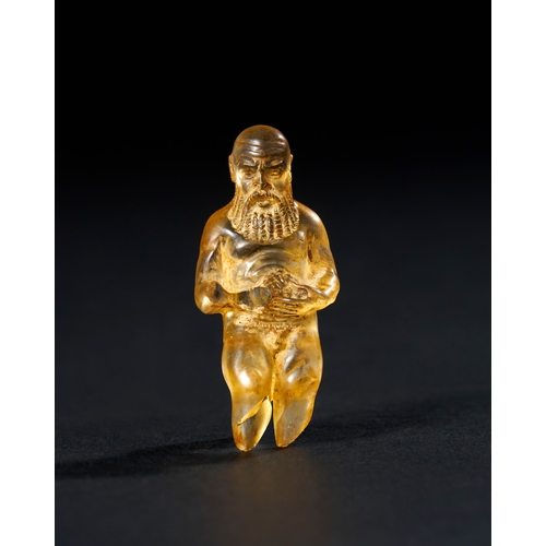 15 - A ROMAN ROCK CRYSTAL FIGURE OF SILENUS HOLDING GRAPES, 2ND CENTURY A.D. This finely crafted Roman ro... 