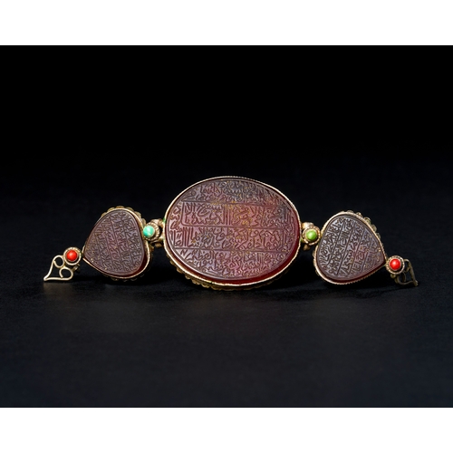 150 - A PERSIAN CARNELIAN AGATE THREE SECTIONAL BAZU-BAND, PERSIA, 19TH CENTURY A 19th-century Persian baz... 