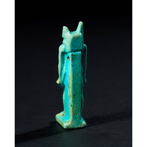 22 - AN EGYPTIAN FAIENCE AMULET DEPICTING ANUBIS, LATE PERIOD TO PTOLEMAIC PERIOD, 664-30 B.C. This amule... 