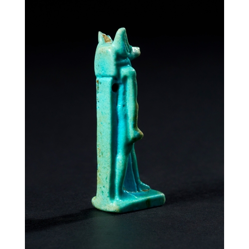 22 - AN EGYPTIAN FAIENCE AMULET DEPICTING ANUBIS, LATE PERIOD TO PTOLEMAIC PERIOD, 664-30 B.C. This amule... 