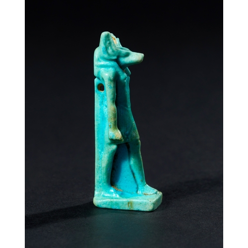 22 - AN EGYPTIAN FAIENCE AMULET DEPICTING ANUBIS, LATE PERIOD TO PTOLEMAIC PERIOD, 664-30 B.C. This amule... 