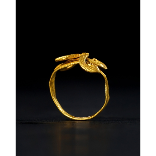 26 - A ROMAN - EGYPT GOLD RING IN THE FORM OF A COBRA SNAKE, 100 B.C. This exquisite gold ring, dating to... 