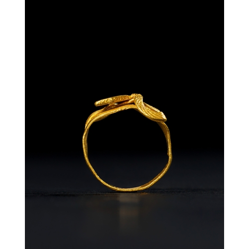 26 - A ROMAN - EGYPT GOLD RING IN THE FORM OF A COBRA SNAKE, 100 B.C. This exquisite gold ring, dating to... 