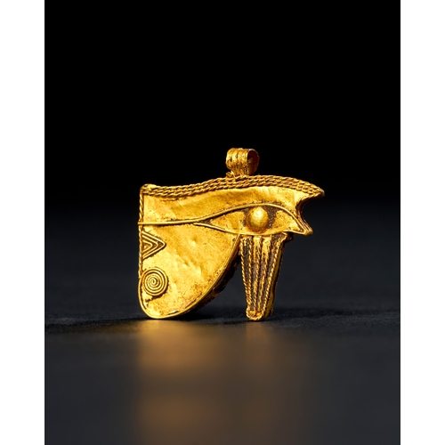 9 - AN EGYPTIAN GOLD AMULET OF THE EYE OF HORUS (WEDJAT), LATE PERIOD TO PTOLEMAIC PERIOD, 664-30 B.C. T... 