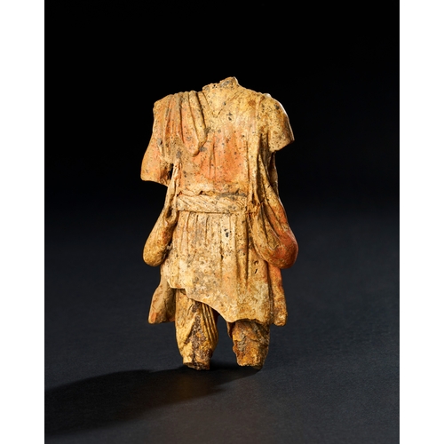 91 - TERRACOTTA FIGURE OF A TRADER, ROMAN OR PARTHIAN PERIOD This terracotta figure, likely representing ... 