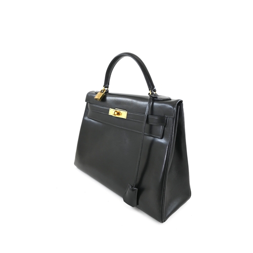 18 - Hermes Kelly 32 Black Box Handbag Hermes Kelly 32 Black, 32cm.     Hardware: Gold    Leather: B... 