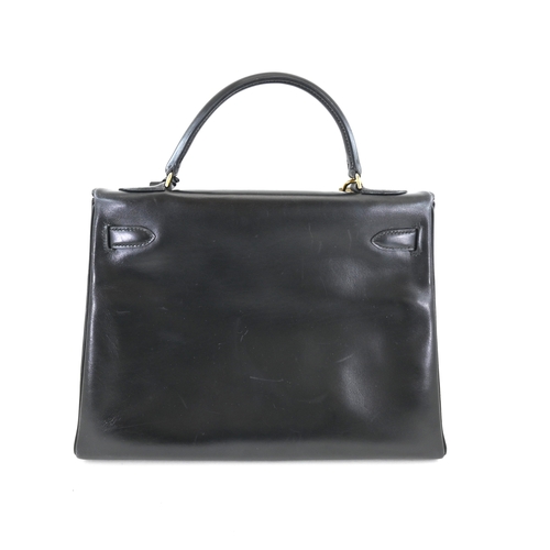 18 - Hermes Kelly 32 Black Box Handbag Hermes Kelly 32 Black, 32cm.     Hardware: Gold    Leather: B... 