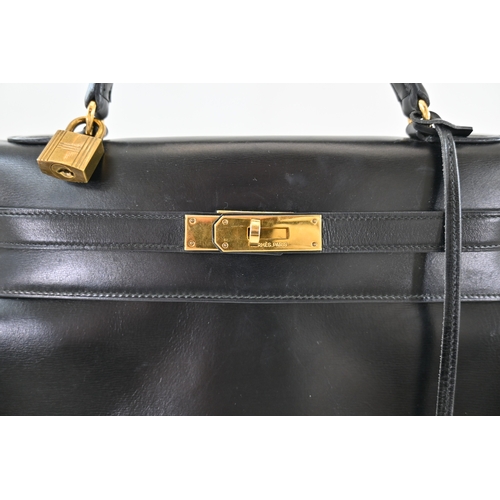 18 - Hermes Kelly 32 Black Box Handbag Hermes Kelly 32 Black, 32cm.     Hardware: Gold    Leather: B... 