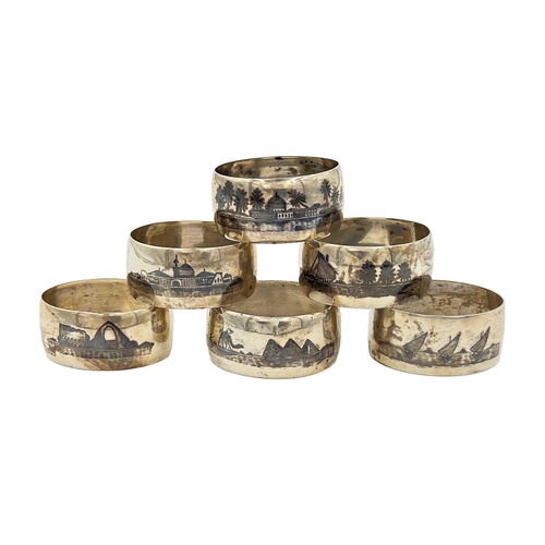 186 - A SET OF SIX MID-20TH CENTURY IRAQI SILVER AND NIELLO NAPKIN RINGS Weight: 130g