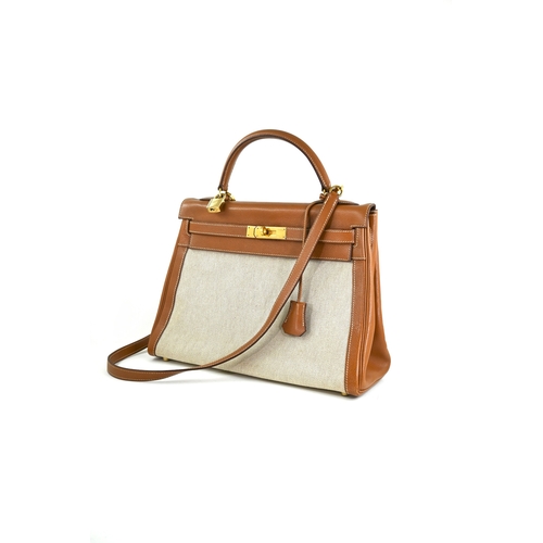 19 - Hermes Kelly 32 Gold & Natural Handbag Hermes Kelly 32 Gold + Naturel, 32cm.     Hardware: Gold... 