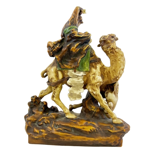 196 - AN EARLY 20TH CENTURY ORIENTALIST PORCELAIN MODEL OF A LION HUNTER BY AMPHORA AN EARLY 20TH CENTURY ... 