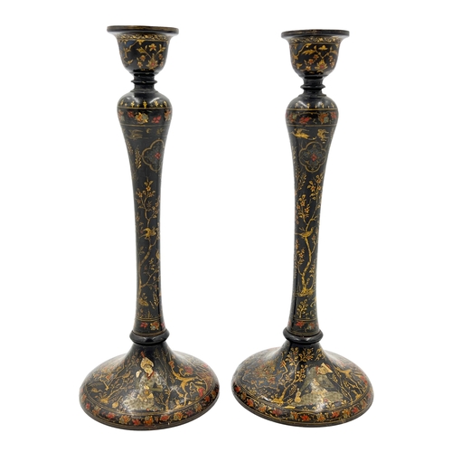 206 - A PAIR OF PERSIAN CANDLE HOLDERS, POSSIBLY QAJAR ERA A pair of Persian candle holders attributed to ... 