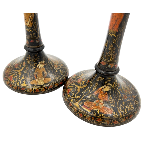 206 - A PAIR OF PERSIAN CANDLE HOLDERS, POSSIBLY QAJAR ERA A pair of Persian candle holders attributed to ... 