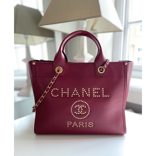 3 - A Red Chanel Deauville PM Tote Chanel Deauville PM Tote in Red, 33cm.     Hardware: Gold    Lea... 