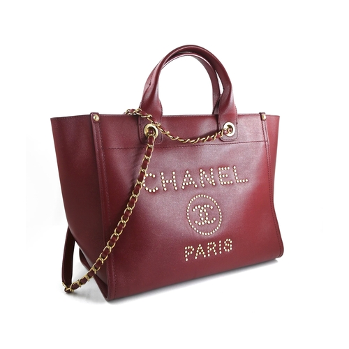 3 - A Red Chanel Deauville PM Tote Chanel Deauville PM Tote in Red, 33cm.     Hardware: Gold    Lea... 