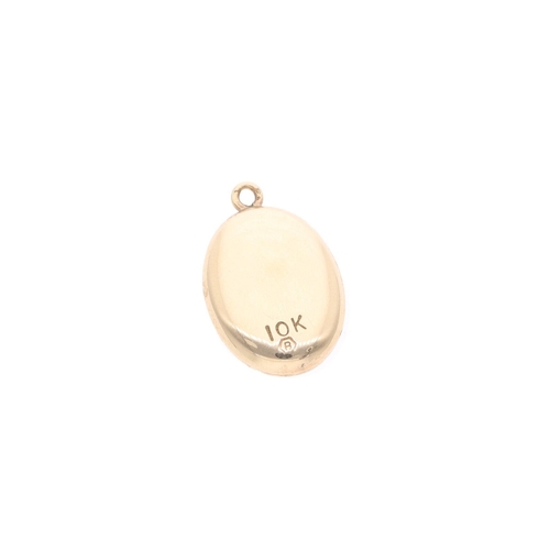 58 - 10ct Gold Oval Floral Pendant 10ct Gold Oval Floral Pendant            HALLMARKS: marked for 10ct Go... 