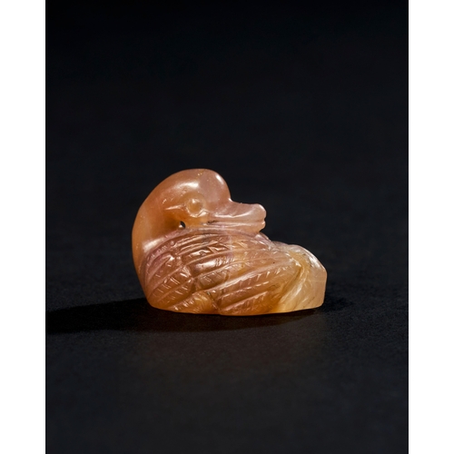 11 - CHALCEDONY AGATE AMULET OF A SEATED DUCK, ACHAEMENID PERIOD, PROBABLY 500-600 B.C. A chalcedony agat... 