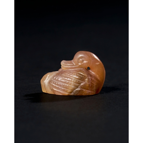 11 - CHALCEDONY AGATE AMULET OF A SEATED DUCK, ACHAEMENID PERIOD, PROBABLY 500-600 B.C. A chalcedony agat... 