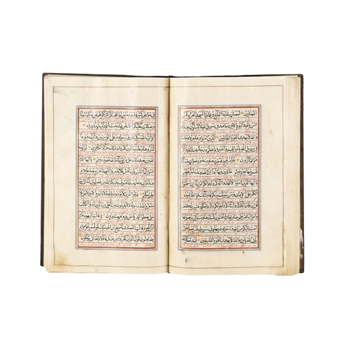 117 - A LARGE ILLUMINATED QURAN, QAJAR, 19TH CENTURY A 19th-century Qajar Quran features elaborate, illumi... 