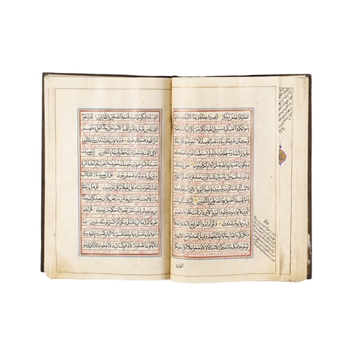 117 - A LARGE ILLUMINATED QURAN, QAJAR, 19TH CENTURY A 19th-century Qajar Quran features elaborate, illumi... 