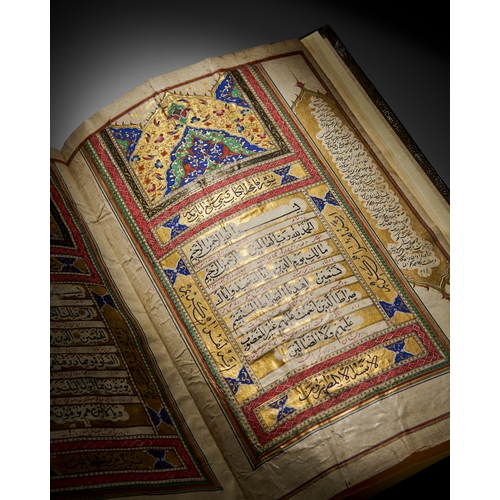 117 - A LARGE ILLUMINATED QURAN, QAJAR, 19TH CENTURY A 19th-century Qajar Quran features elaborate, illumi... 