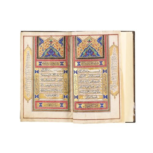 117 - A LARGE ILLUMINATED QURAN, QAJAR, 19TH CENTURY A 19th-century Qajar Quran features elaborate, illumi... 