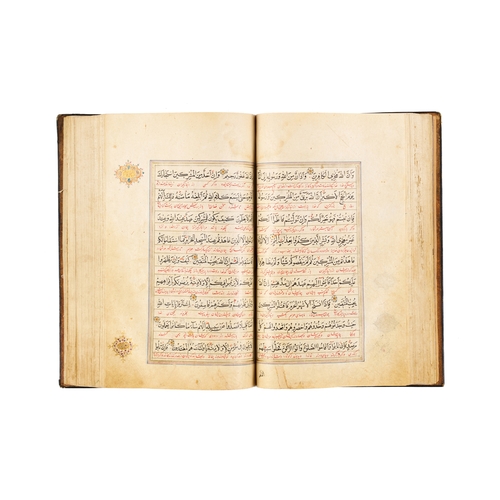 118 - A LARGE ILLUMINATED SAFAVID QURAN DATED AH 1119 / A.D. 1707 This large Safavid Quran, dated ahead of... 