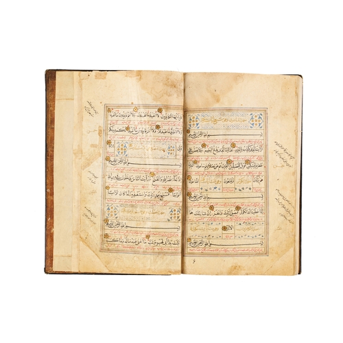 118 - A LARGE ILLUMINATED SAFAVID QURAN DATED AH 1119 / A.D. 1707 This large Safavid Quran, dated ahead of... 