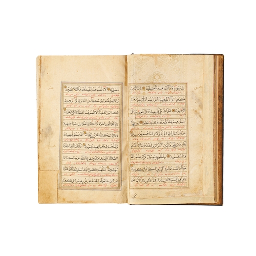 118 - A LARGE ILLUMINATED SAFAVID QURAN DATED AH 1119 / A.D. 1707 This large Safavid Quran, dated ahead of... 