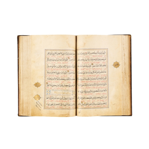 118 - A LARGE ILLUMINATED SAFAVID QURAN DATED AH 1119 / A.D. 1707 This large Safavid Quran, dated ahead of... 