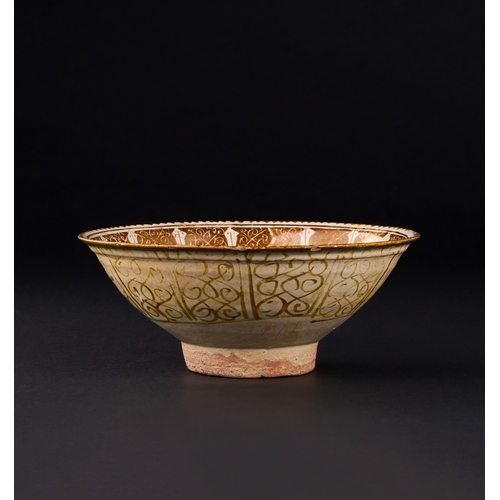 143 - A KASHAN LUSTRE BOWL WITH STYLISED VEGETAL DECORATION, PERSIA, 13TH CENTURY of shallow round form wi... 