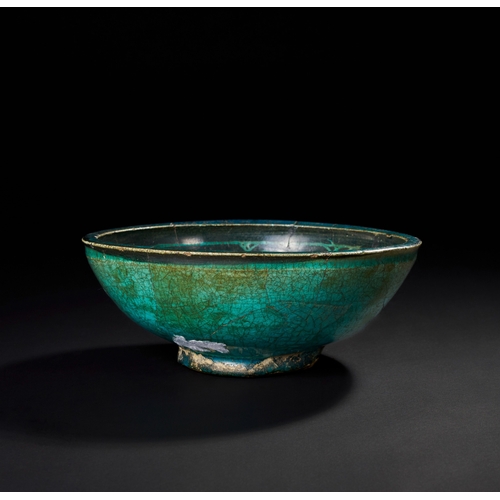 145 - A 12TH-13TH CENTURY PERSIAN SELJUK GLAZED POTTERY SILHOUETTE WARE BOWL    A 12th-13th century Persia... 