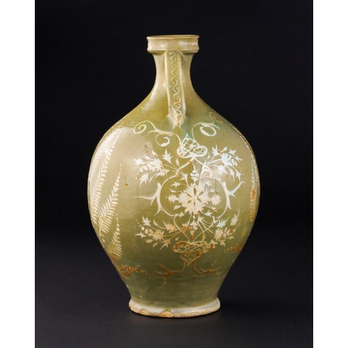 147 - A SAFAVID CELADON POTTERY VASE, PERSIA, 17TH CENTURY of bulbous form on a short splayed foot with wa... 