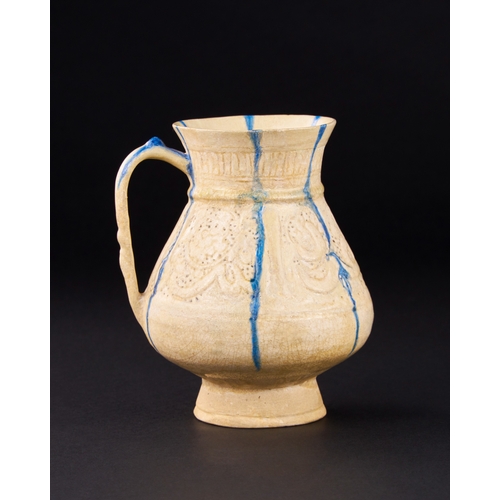 148 - A KASHAN PIERCED AND INCISED BLUE AND WHITE POTTERY JUG, PERSIA, 12TH/ 13TH CENTURY    of piriform o... 