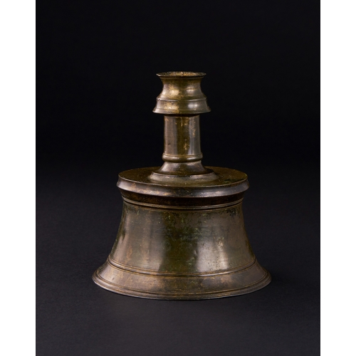 161 - A TIMURID BRONZE CANDLESTICK, IRAN, 15TH CENTURY    With slightly tapering cylindrical body and flat... 