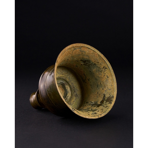 161 - A TIMURID BRONZE CANDLESTICK, IRAN, 15TH CENTURY    With slightly tapering cylindrical body and flat... 