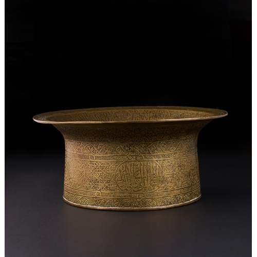 162 - A MAMLUK ENGRAVED BRASS BASIN, EGYPT OR SYRIA, EARLY 16TH CENTURY of waisted form with flaring evert... 