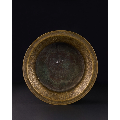 162 - A MAMLUK ENGRAVED BRASS BASIN, EGYPT OR SYRIA, EARLY 16TH CENTURY of waisted form with flaring evert... 