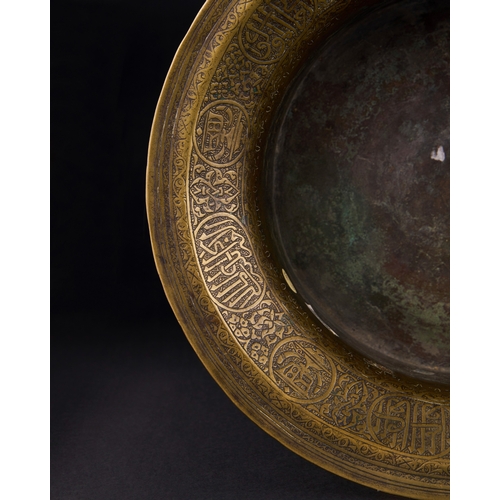 162 - A MAMLUK ENGRAVED BRASS BASIN, EGYPT OR SYRIA, EARLY 16TH CENTURY of waisted form with flaring evert... 