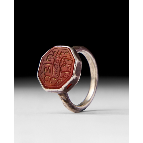 20 - AN AGATE ISLAMIC SEAL SILVER RING, DATED 1215 HIJRI This antique Islamic agate ring features a beaut... 