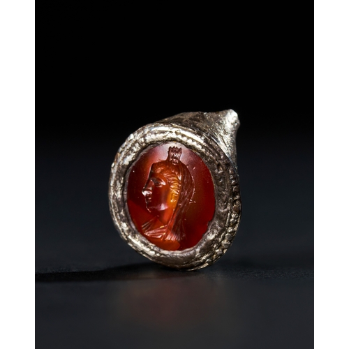 32 - FRAGMENTARY ROMAN CARNELIAN AGATE WITH A DEPICTION OF A FEMALE DEITY PROBABLY POSING AS SERAPIS, 2ND... 