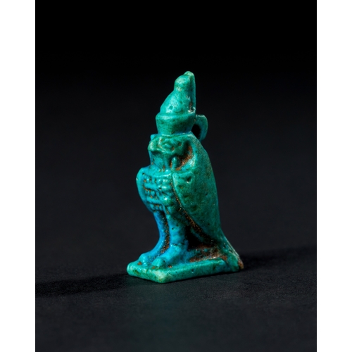 7 - EGYPTIAN BLUE GALZED HORUS AMULET, CIRCA 1300 - 700 B.C. A vibrant blue-glazed amulet represents the... 