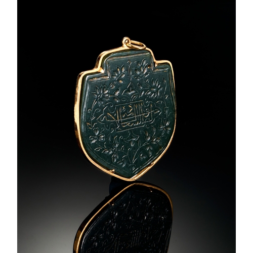 116 - A TIMMURID ENGRAVED JADE PENDENT IN A GOLD MOUNTED, 14TH - 15TH CENTURY  A remarkable Timurid-era pe... 