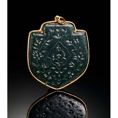 116 - A TIMMURID ENGRAVED JADE PENDENT IN A GOLD MOUNTED, 14TH - 15TH CENTURY  A remarkable Timurid-era pe... 